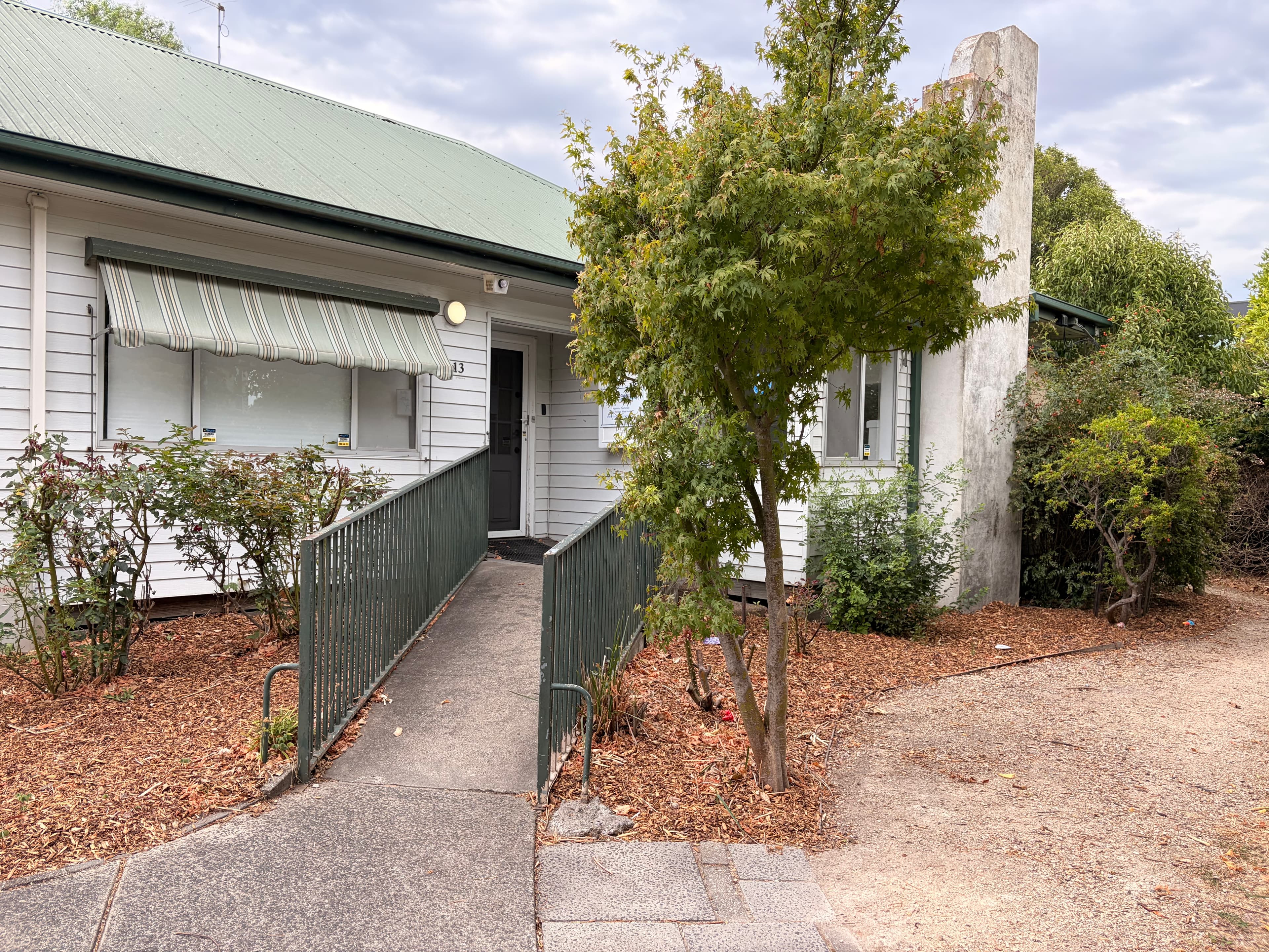 The ramped entry to the clinic — leading back out to the footpath.