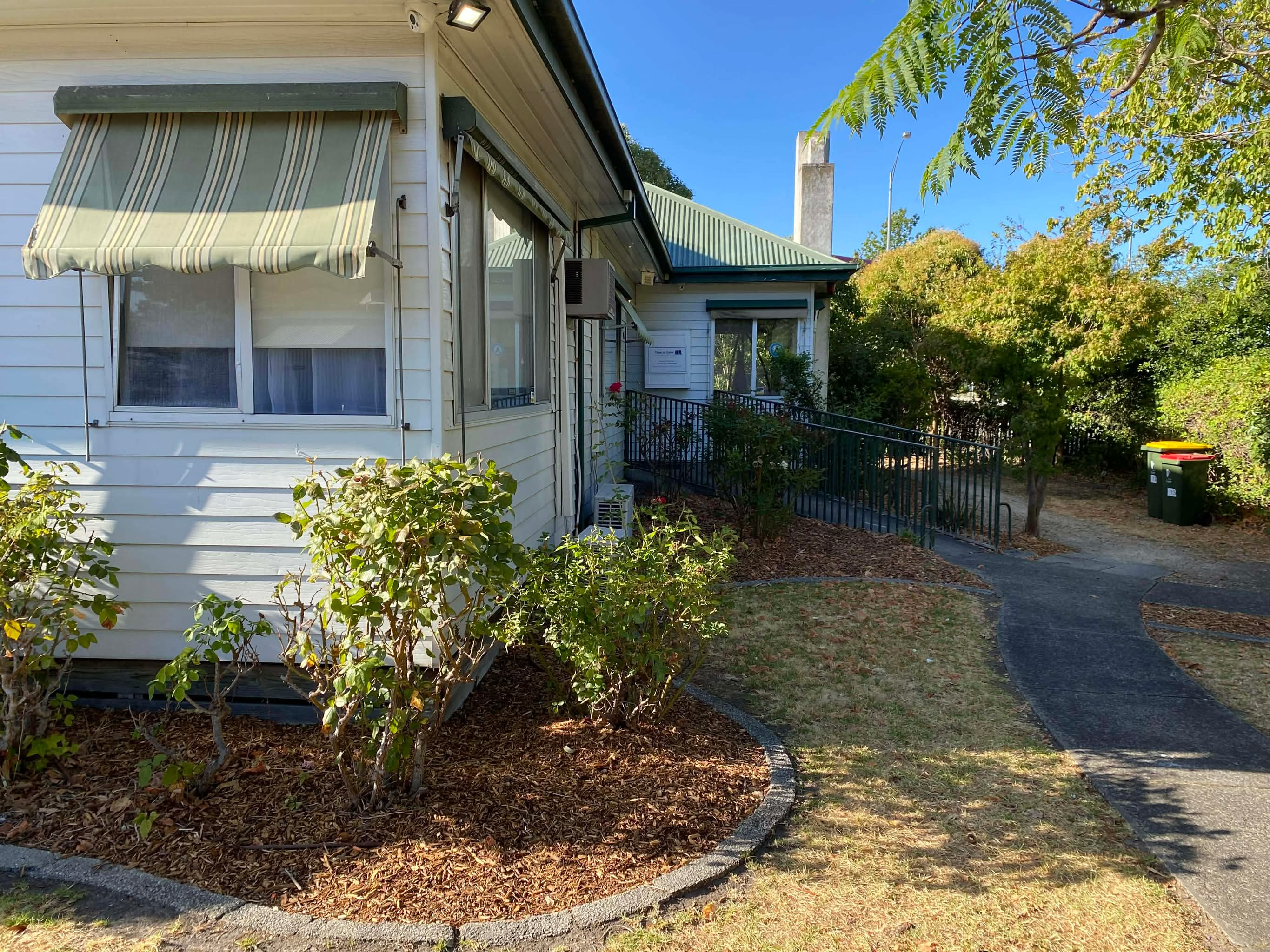 The Brain Helpers Psychology clinic — a weatherboard cottage on Clyde Rd, Berwick, with a striped awning and garden.